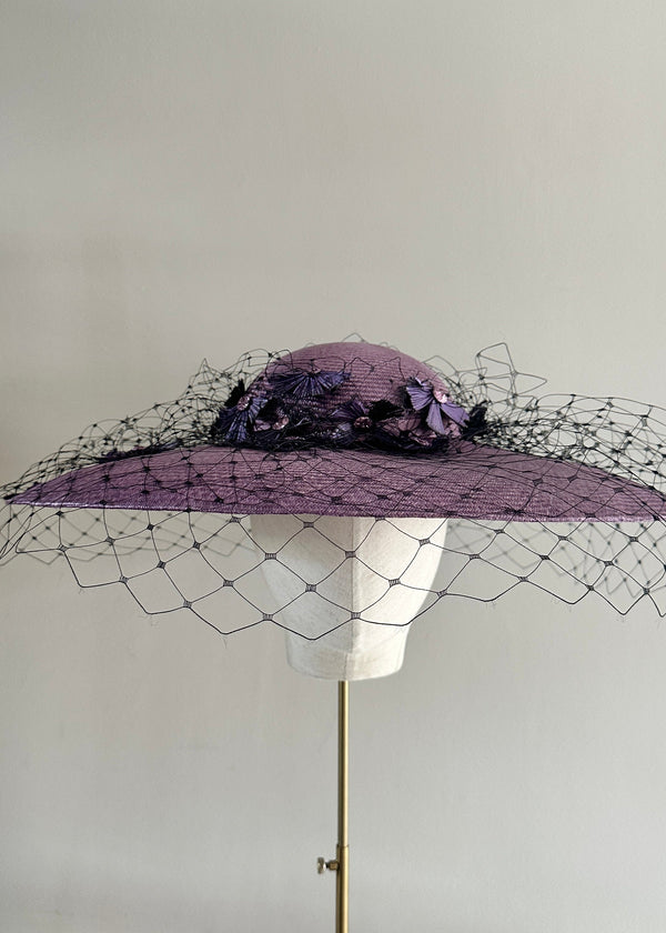Downturned Brim Hat in Straw with Veiling and Vintage Flowers in Purple