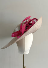 Sculptural Straw hat with Pink Accent.